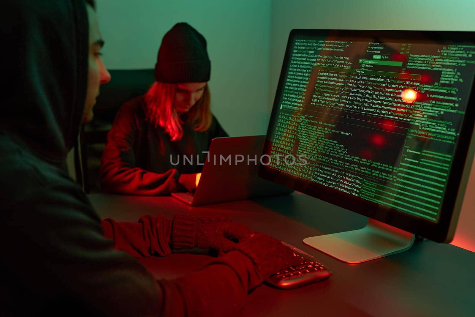 Anonymous people using computer and programming to break code. Cyber security threat. Internet and network security. Access to private information. Anonymous hackers using technology to access to password and encrypted data. Cyber attack