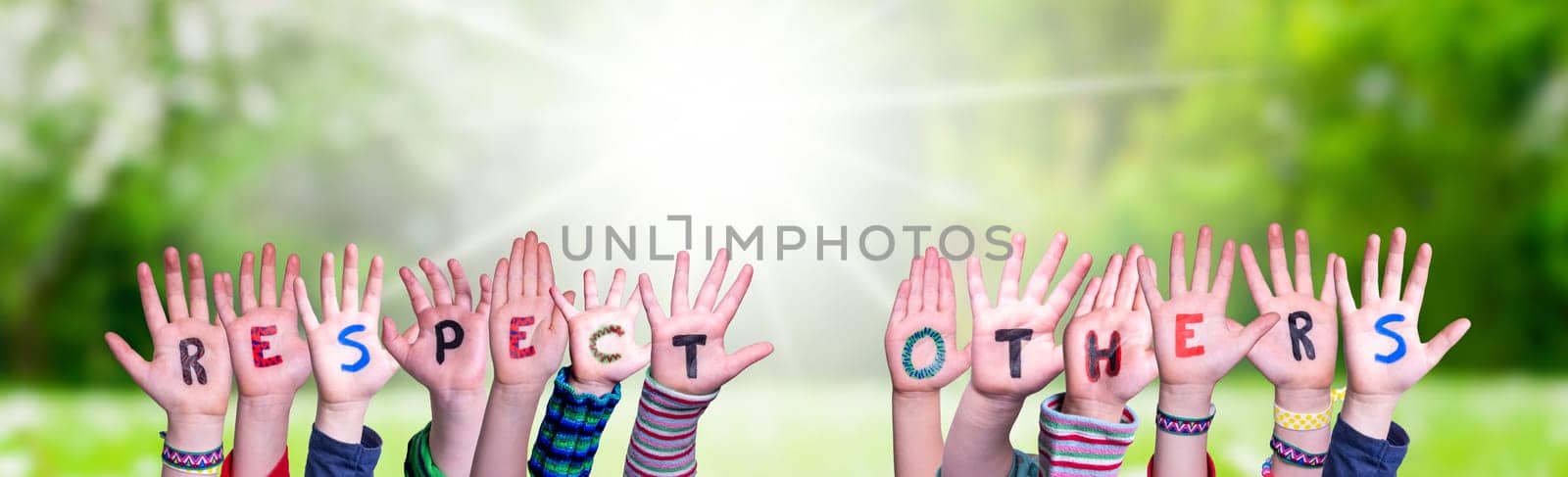 Children Hands Building Colorful English Word Respect Others. Sunny Green Grass Meadow As Background.