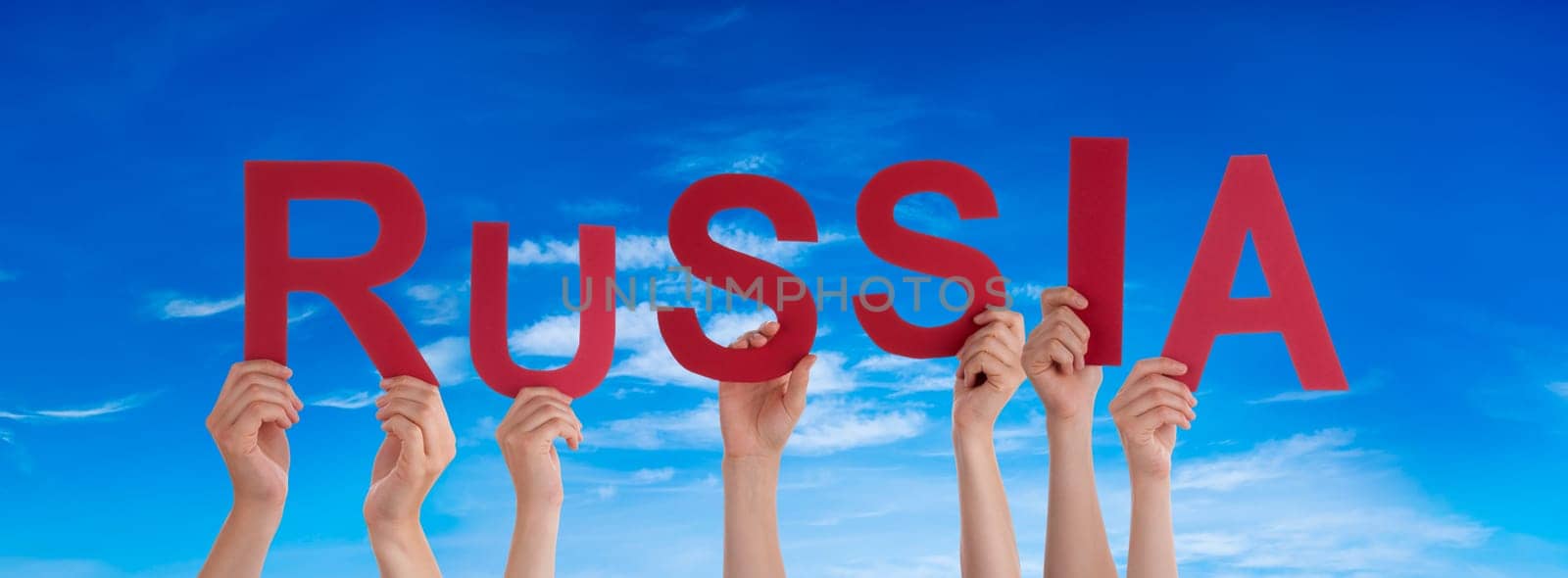 People Or Persons Hands Building English Word Russia. Blue Sky As Background.