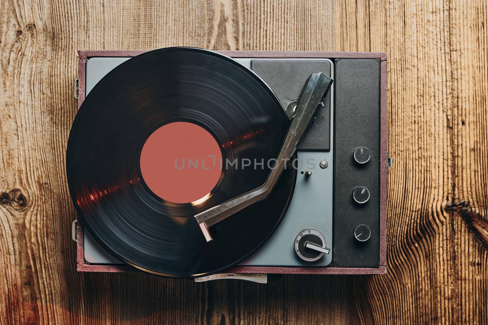 Listening to music from vinyl record. Playing music from analog disk on turntable player. Enjoying music from old collection. Relaxing at home. Retro and vintage. Audio stereo equipment. Analog sound