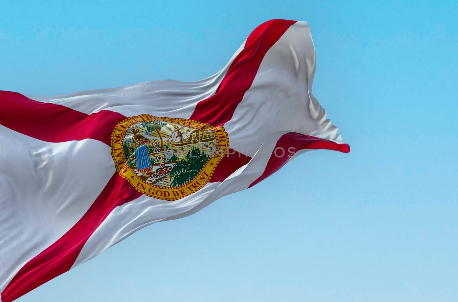 Close-up view of the Florida state flag waving in the wind on a clear day. Red saltire on white with the state seal in the center. 3d illustration render. Fluttering textile.