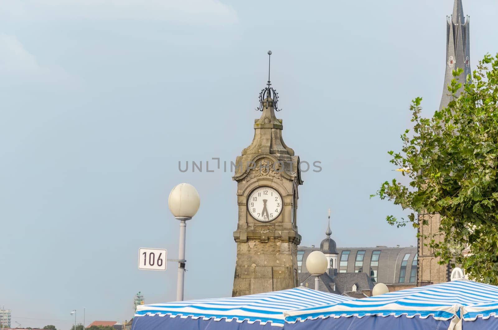 Historic Rhine level clock on the Rhine riverside promenade at Burgplatz near Düsseldorf's Old Town.