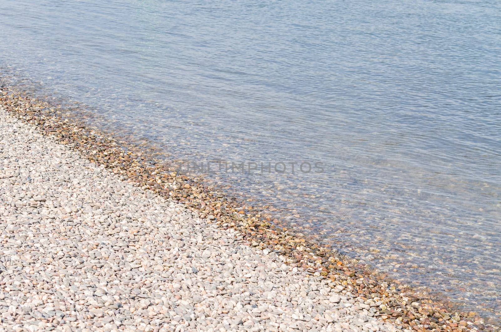Beautiful shoreland with small stones on a river.