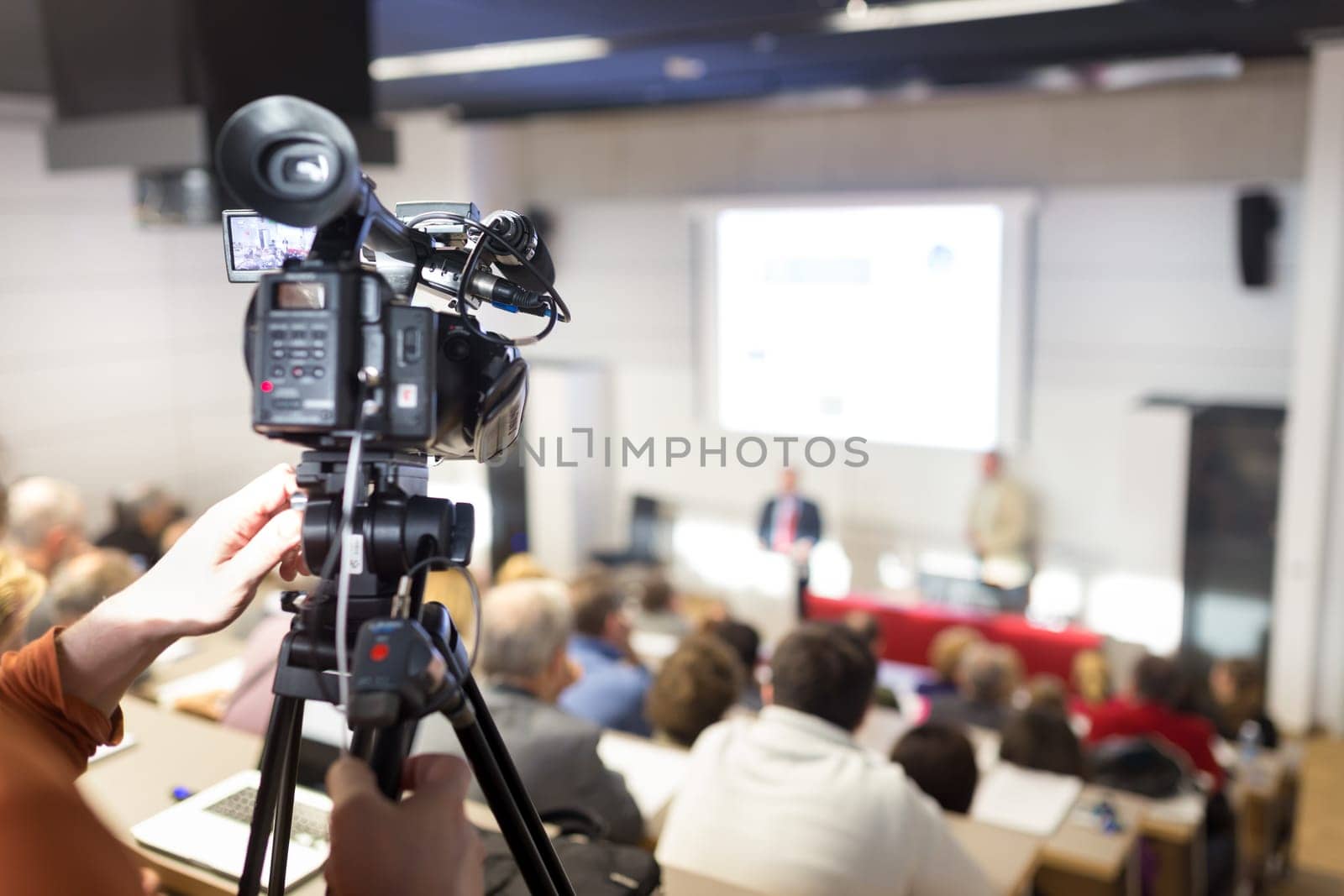 Business Conference and Presentation. Audience at the conference hall. Television broadcasted press conference.