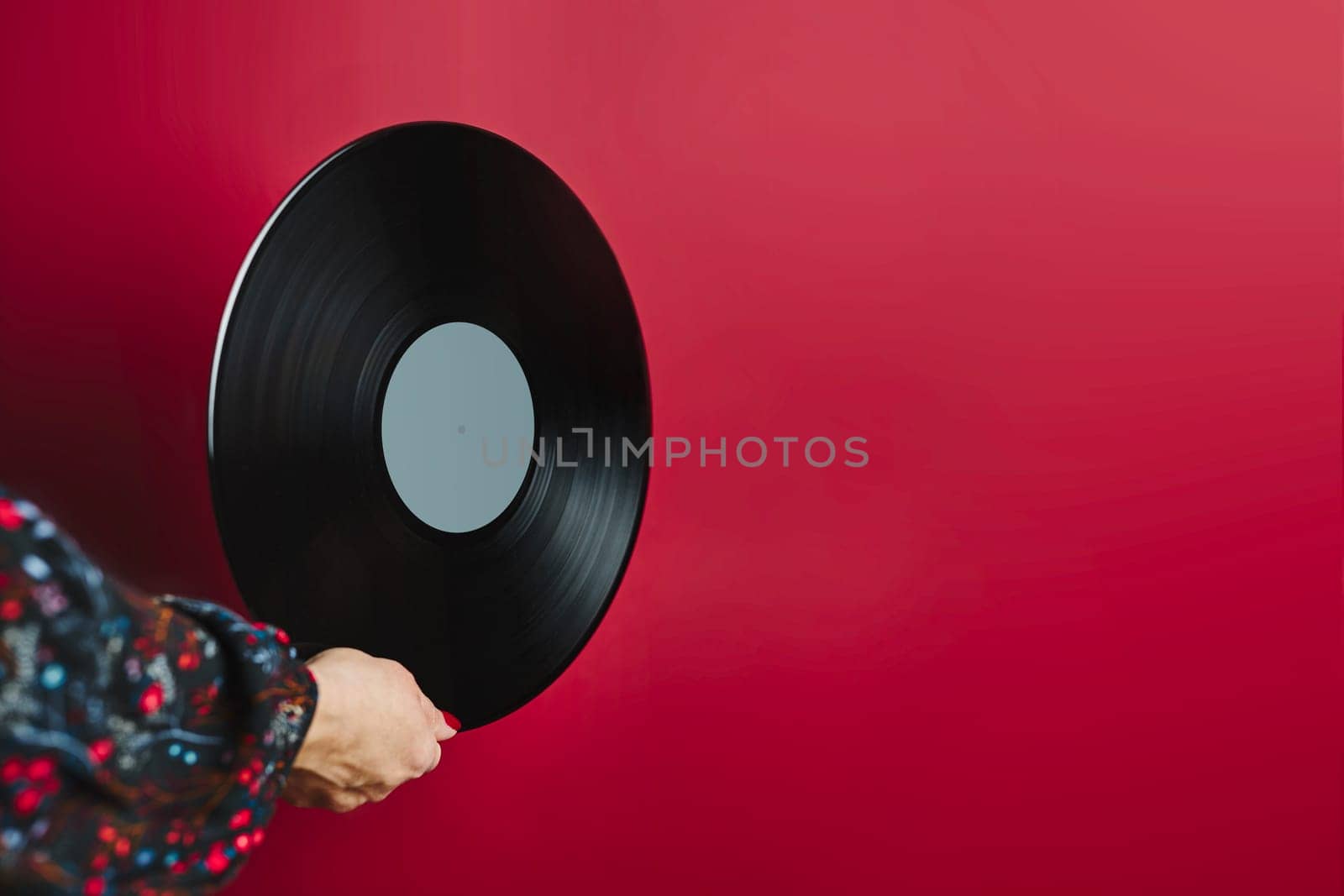 Woman holding vinyl record. Music passion. Listening to music from analog record. Playing music from analog disk on turntable player. Enjoying music from old collection. Retro and vintage. Stereo audio. Analog sound