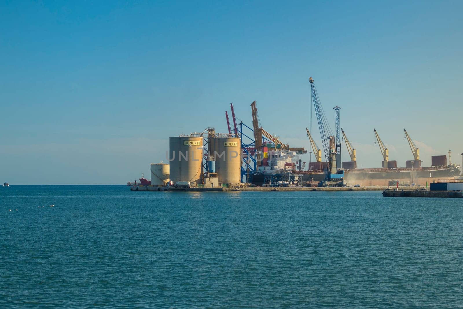 Malaga, Spain, April 2023: View on Goliat Cement factory in the harbor of Malaga, Spain