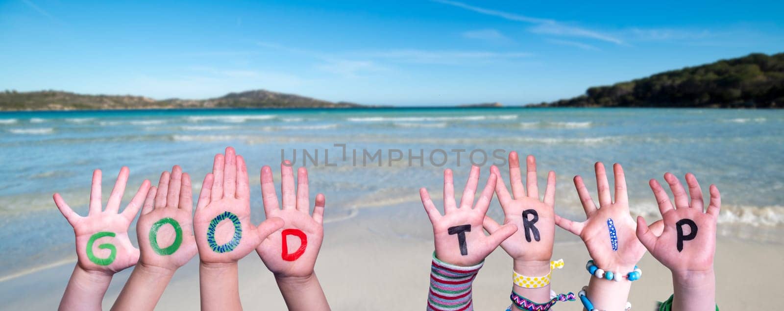 Children Hands Building Colorful English Word Good Trip. Summer Ocean, Sea And Beach As Background