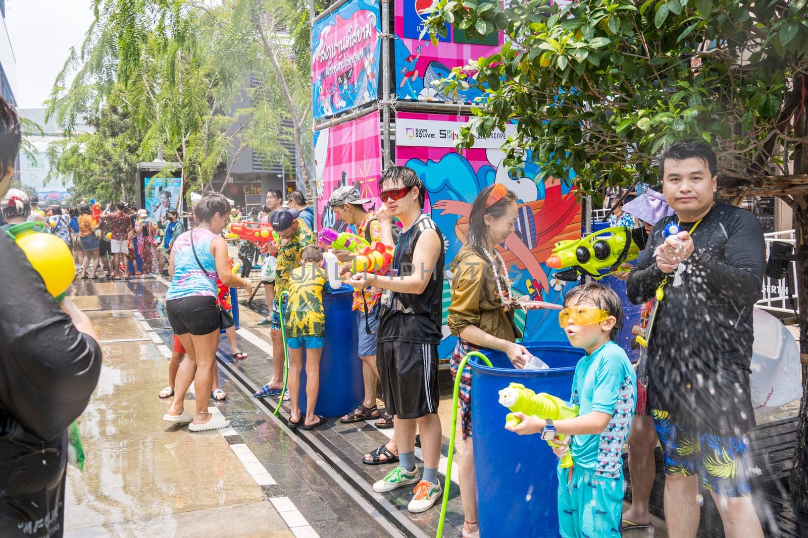 Siam Square, Bangkok, Thailand - APR 13, 2023 Songkran Festival, The short action of people joins celebrations of the Thai New Year or Songkran in Siam Square Bangkok, Thailand.