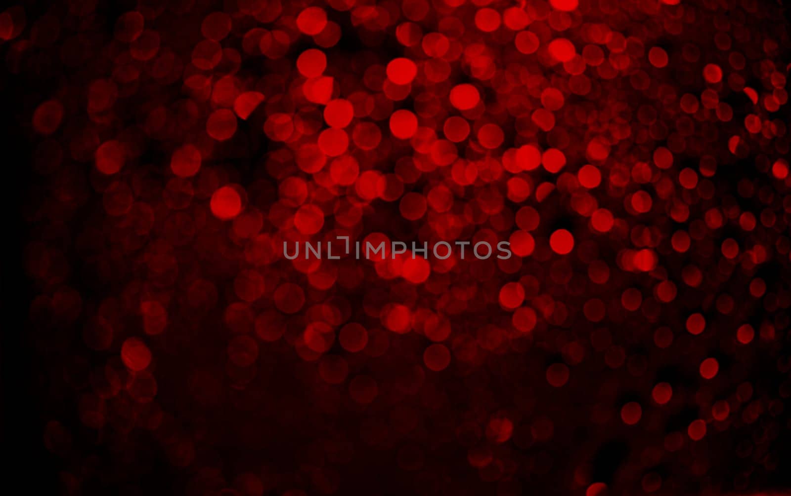 Abstract blur red glitter on black background. Card for Valentine's day, christmas and wedding celebration. Love bokeh sparkle confetti textured layout. Classy elegant design.