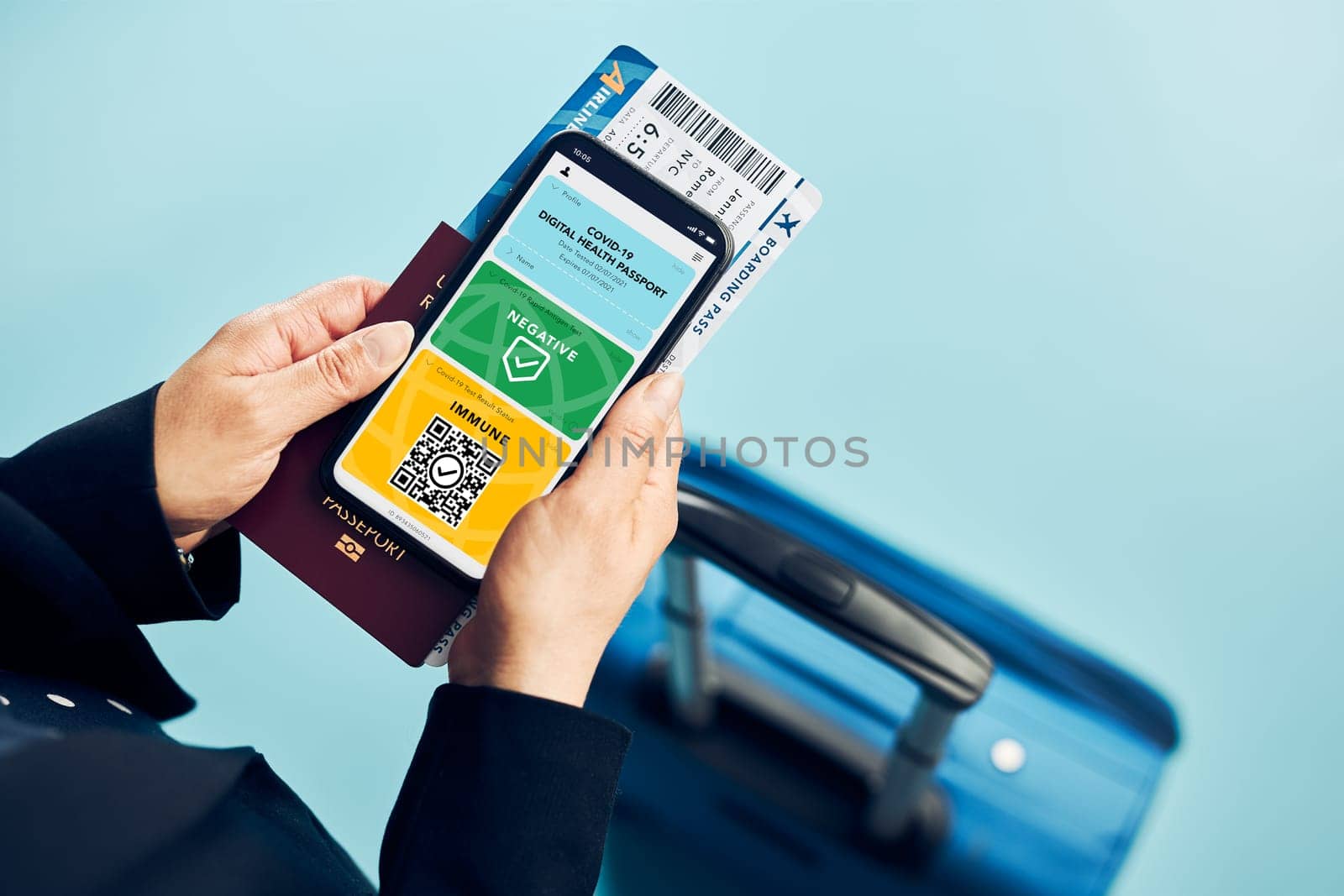 Digital covid certificate. Covid vaccination digital pass. Woman passenger holding digital medical pass on her mobile phone, passport and airplane ticket. Traveler showing digital covid test result as medical pass for travel during covid-19 pandemic