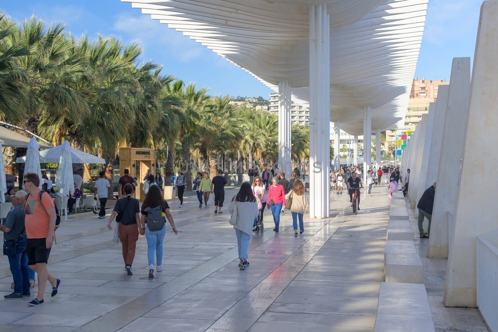 Malaga, Spain, April 2023: View on Palmeral de Las Sorpresas, the modern harbor promenade in Malaga, Spain.