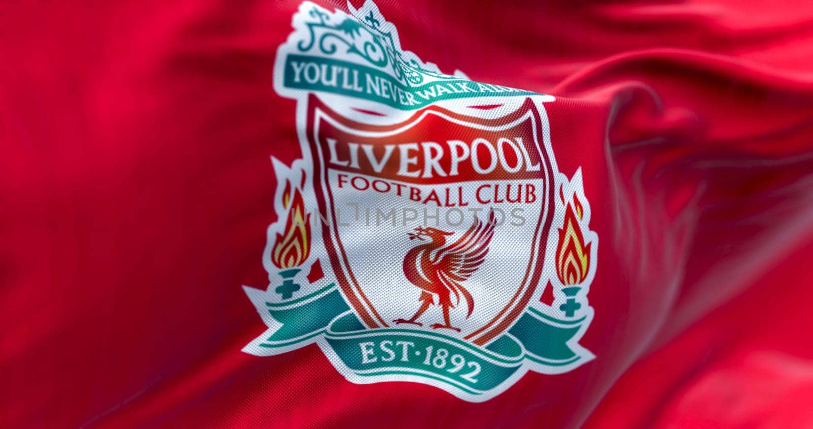 Liverpool, UK, Apr. 2023: Liverpool Football Club flag waving. Liverpool F.C. is an english professional football club. Fabric textured background. Illustrative editorial 3d illustration render
