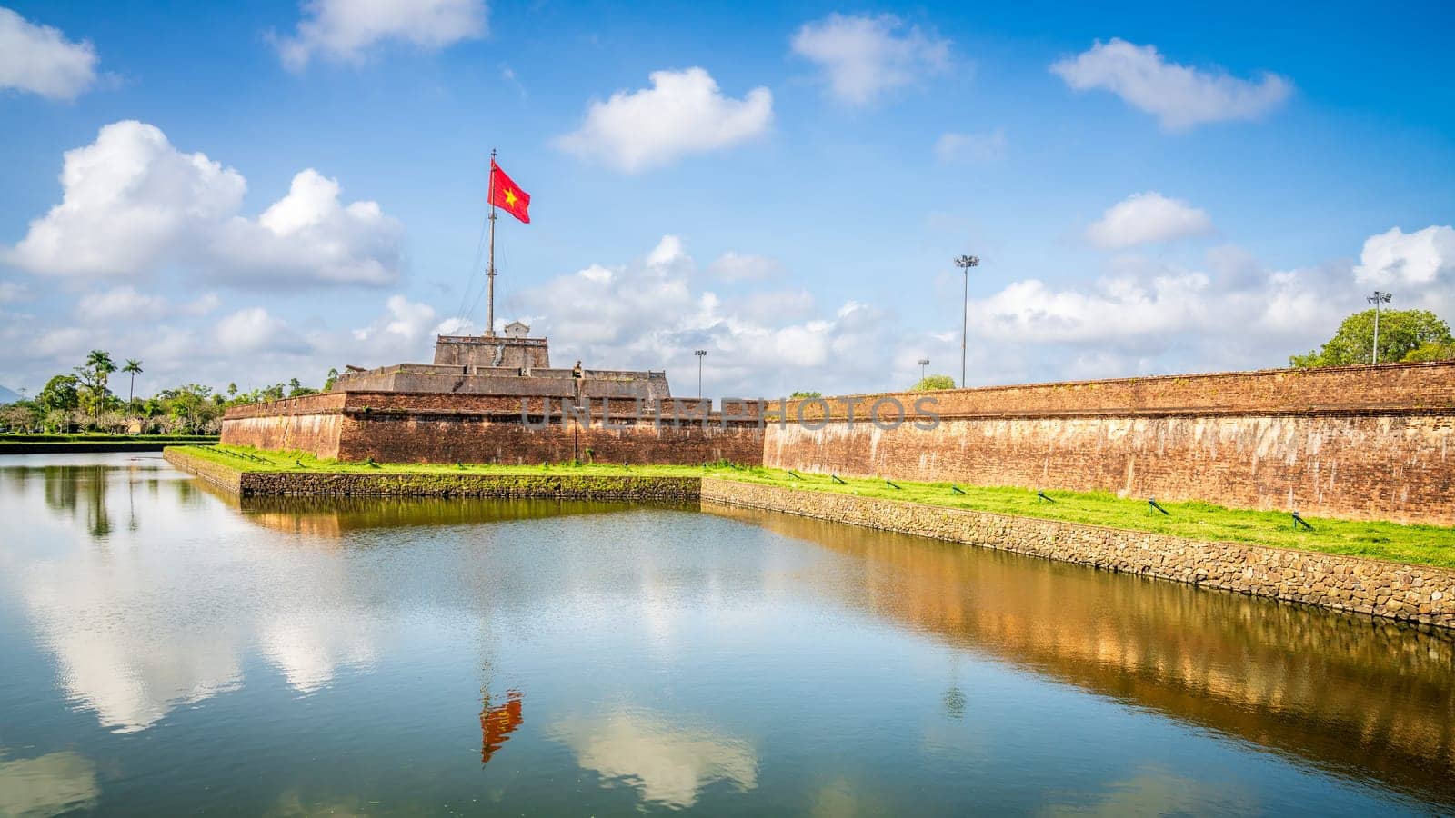 National flag of Vietnam flies over the Citadel in the former capital city of Hue
