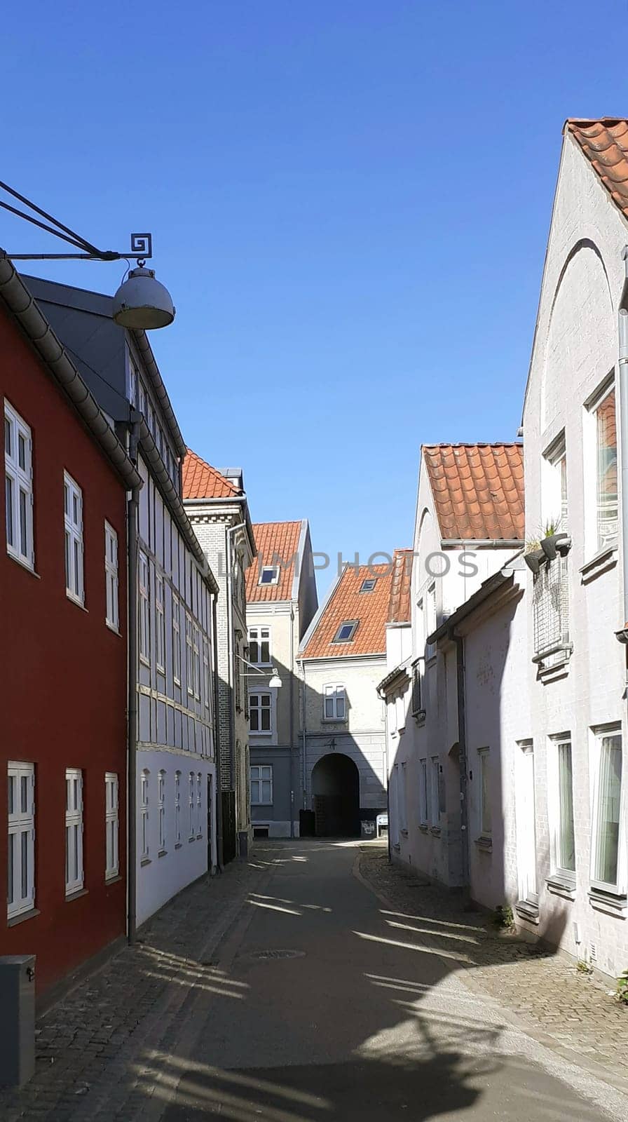 Morning shot of colored houses on a alley in the small town of Aalborg, Denmark