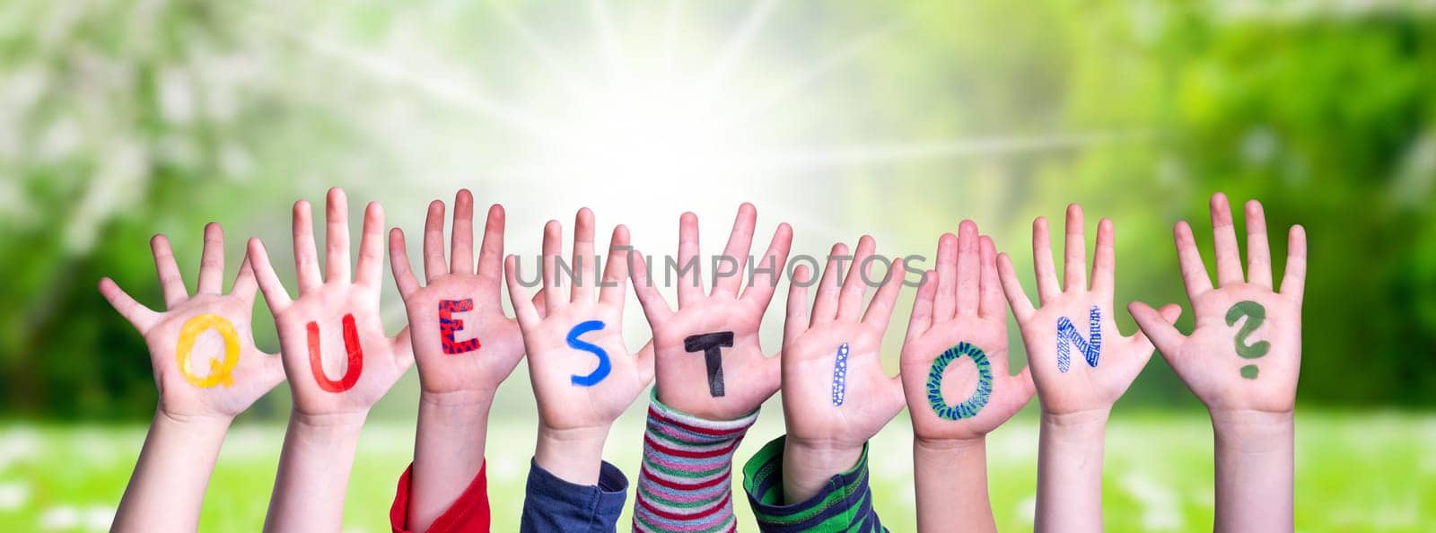Children Hands Building Colorful English Word Question. Summer, Sunny Green Grass Meadow As Background