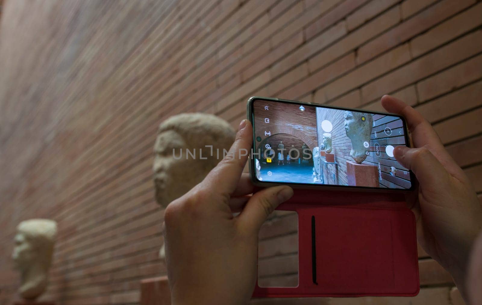 Merida, Spain - May 23th, 2021: Visitor taking pictures at National Museum of Roman Art in Merida, Spain