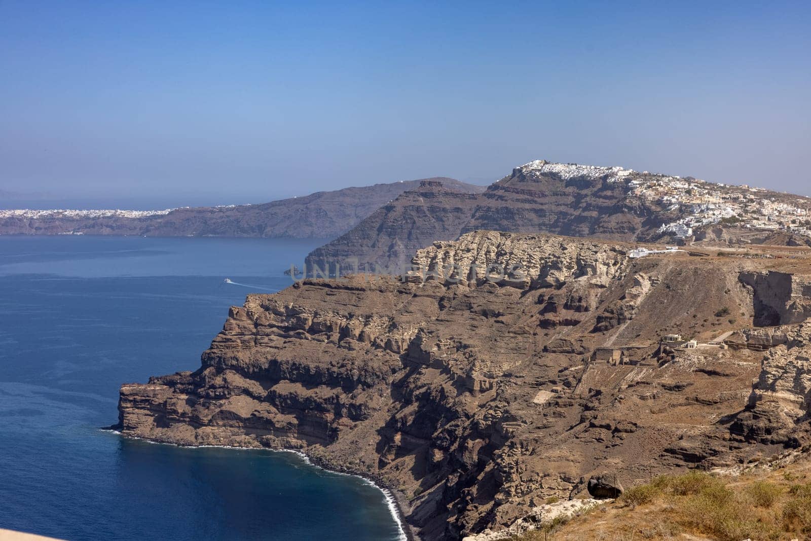 Magnificent view of the majestic volcanic cliffs of Santorini Island, Greece.