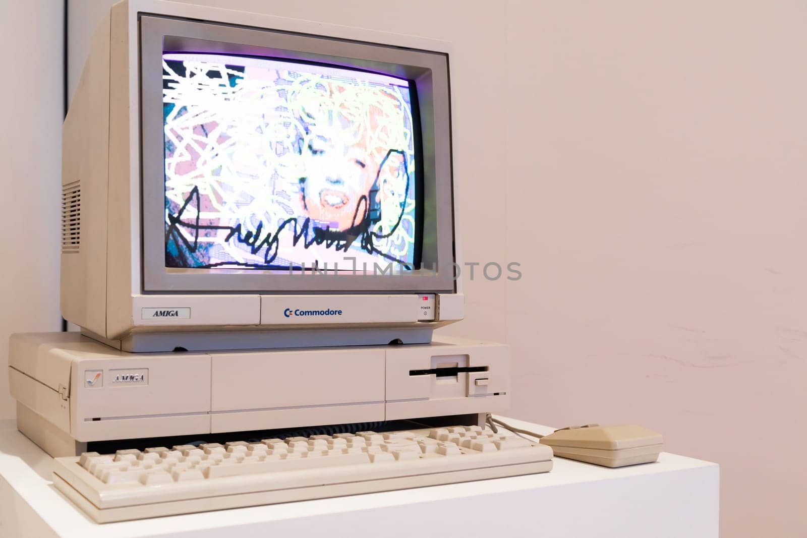 Venaria Reale, Italy - October 2022: Computer Commodore Amiga 1000 with floppy disk, mouse, beige