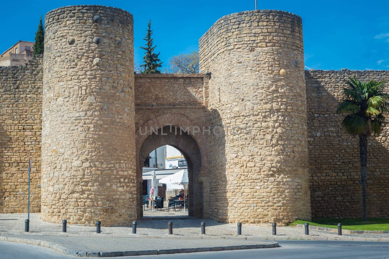 Ronda, Spain, April 2023: View on the Puerta de Almocabar, ancient gate to the town of Ronda, Spain.
