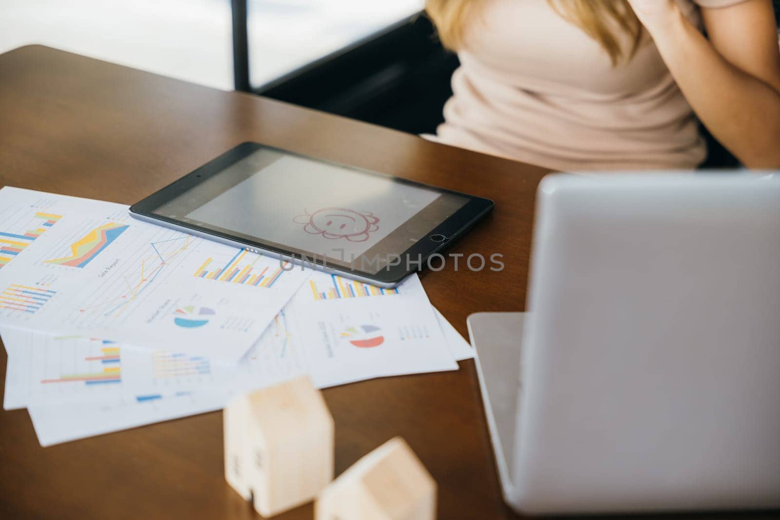 Business woman multitasking while talking on cell phone by smart mobile phone and writing taking notes on digital tablet computer in home office, Asian Student female learning online course at cafe