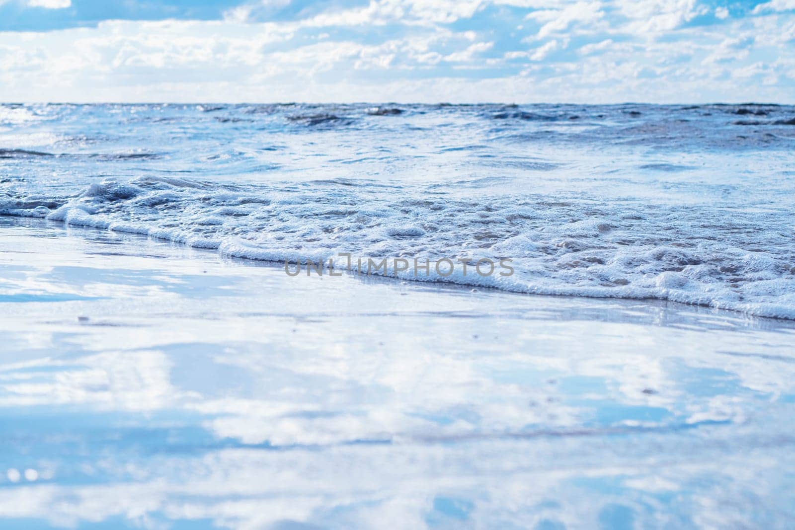 All shades of blue. Sea expanses under sky with white clouds.Meditation and relaxation. Interior paintings. Wonderful moments of life. Tourism and travel. Splendor of nature. Rest and pleasure.