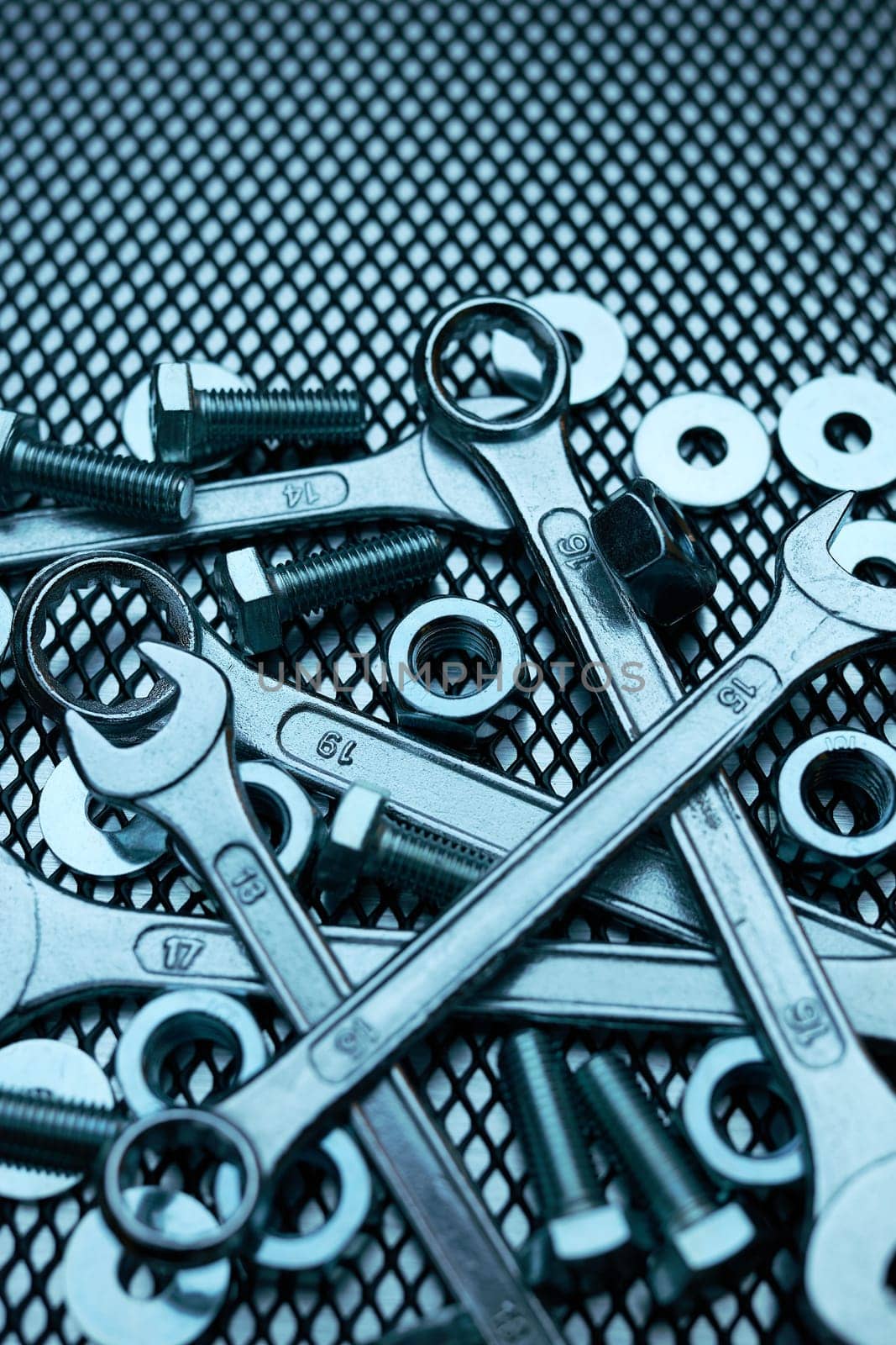 Set of chrome wrenches on steel surface. Mechanic tools for maintenance. Hardware tools to fix. Technical tools background