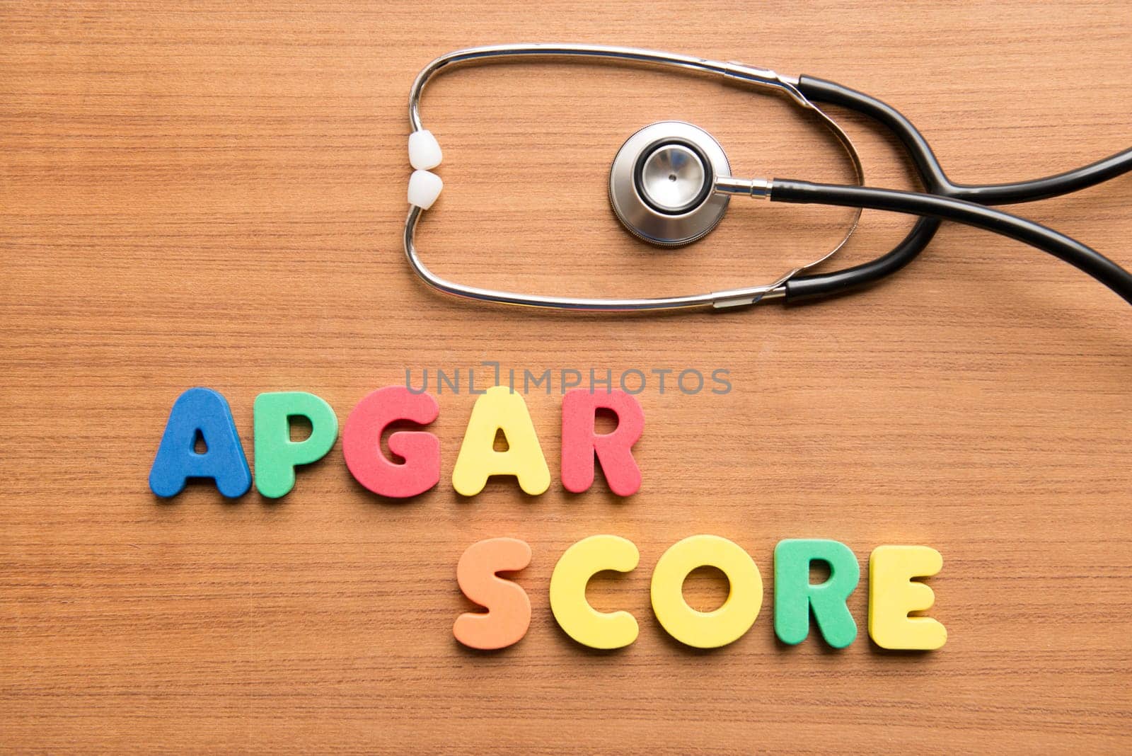 Apgar score colorful word with stethoscope on the wooden background,birth