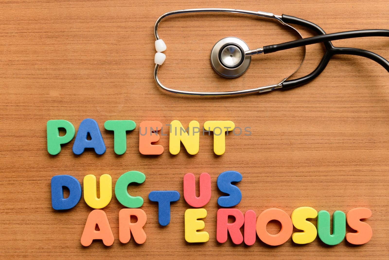 Patent ductus arteriosus (PDA) colorful word on the wooden background
