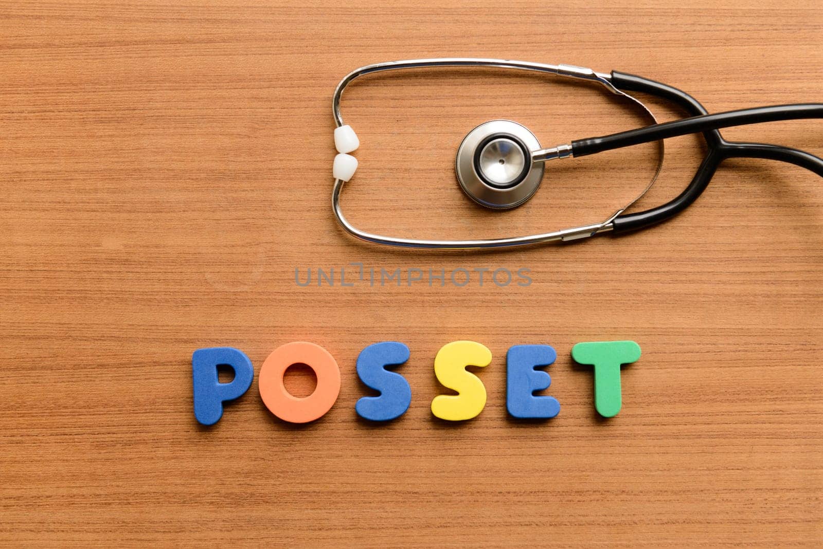 Posset colorful word on the wooden background
