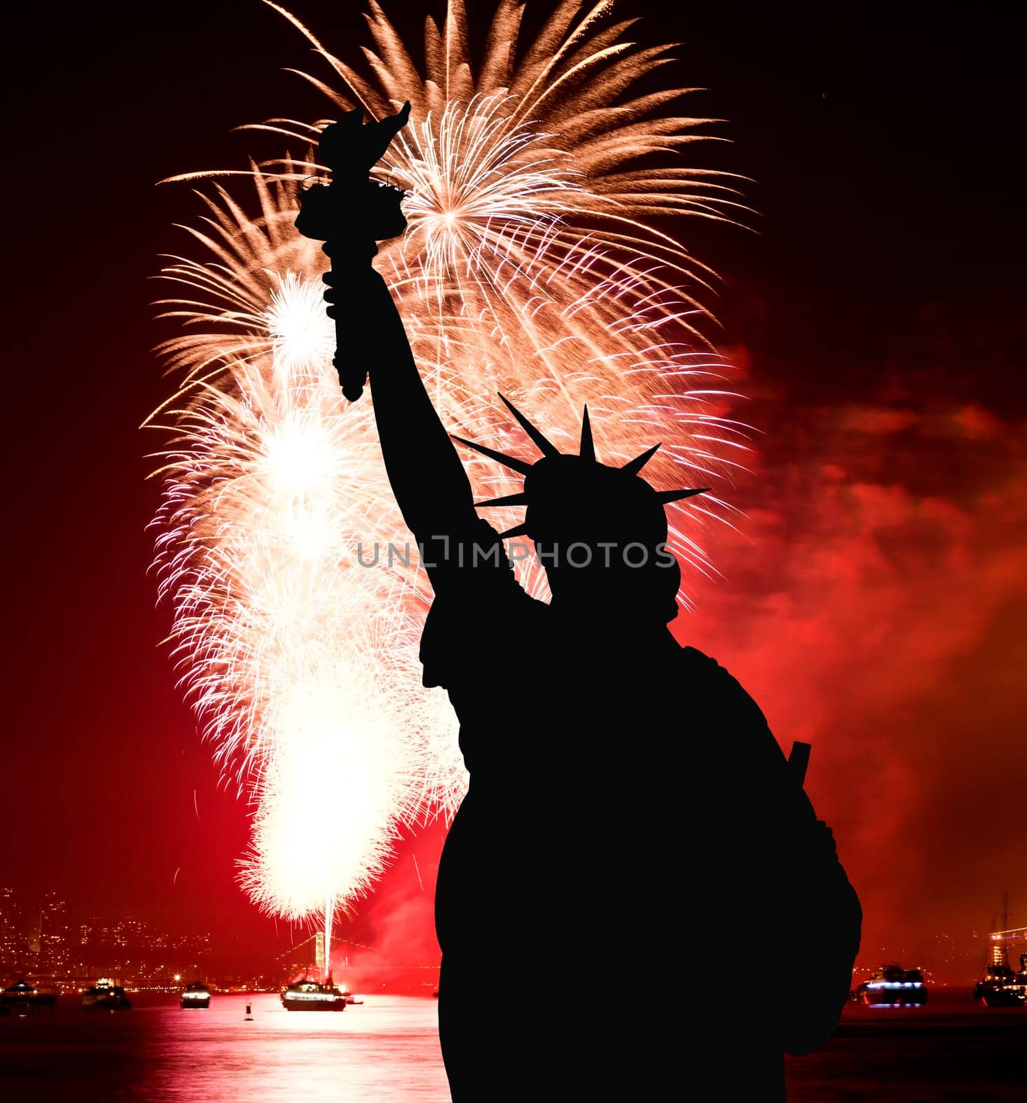 The silhouette of Statue of Liberty Statue of Liberty and July 4th fireworks over Hudson River