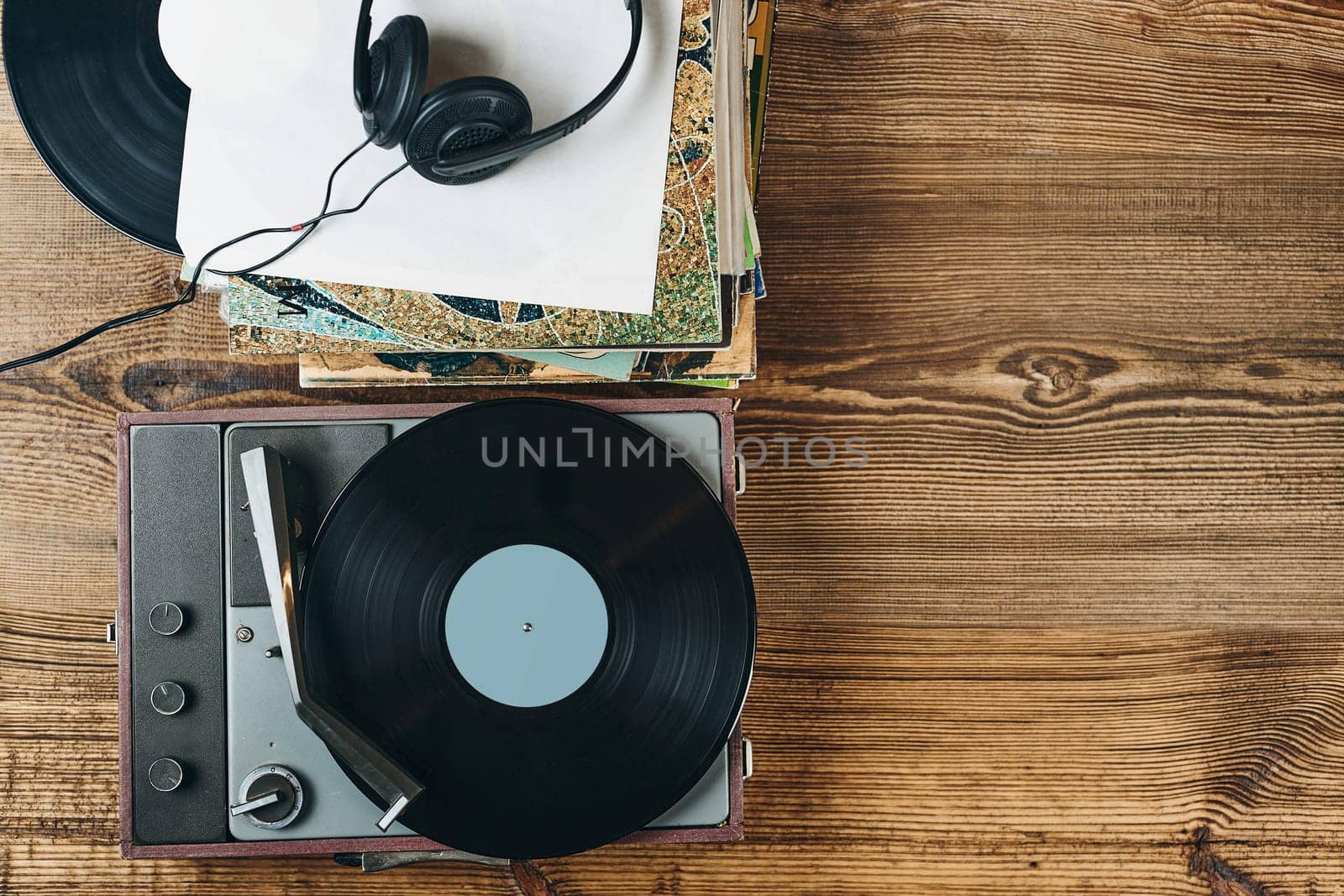 Listening to music from vinyl record. Playing music from analog disk on turntable player. Enjoying music from old collection. Relaxing at home. Retro and vintage. Audio stereo equipment. Analog sound. Ready for content