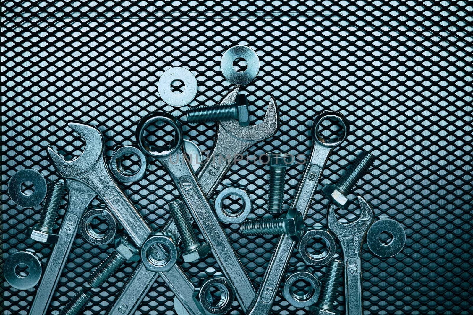 Set of chrome wrenches on steel surface. Mechanic tools for maintenance. Hardware tools to fix. Technical tools background
