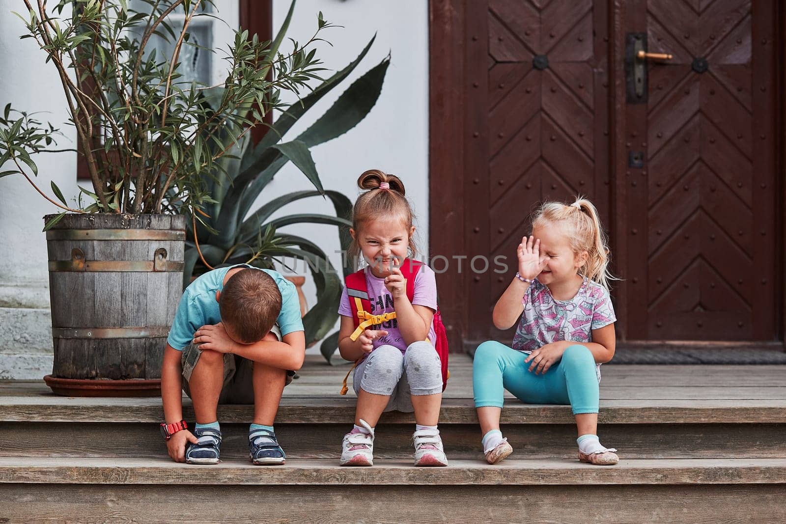 Children making silly faces. Kids having fun showing goofy poses posing to camera. Real people, authentic situations