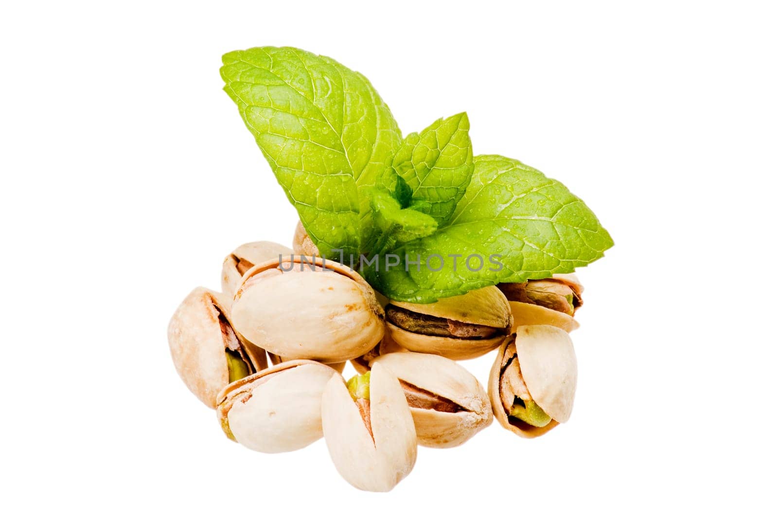 Closeup pistachios and fresh mint on white backgroud