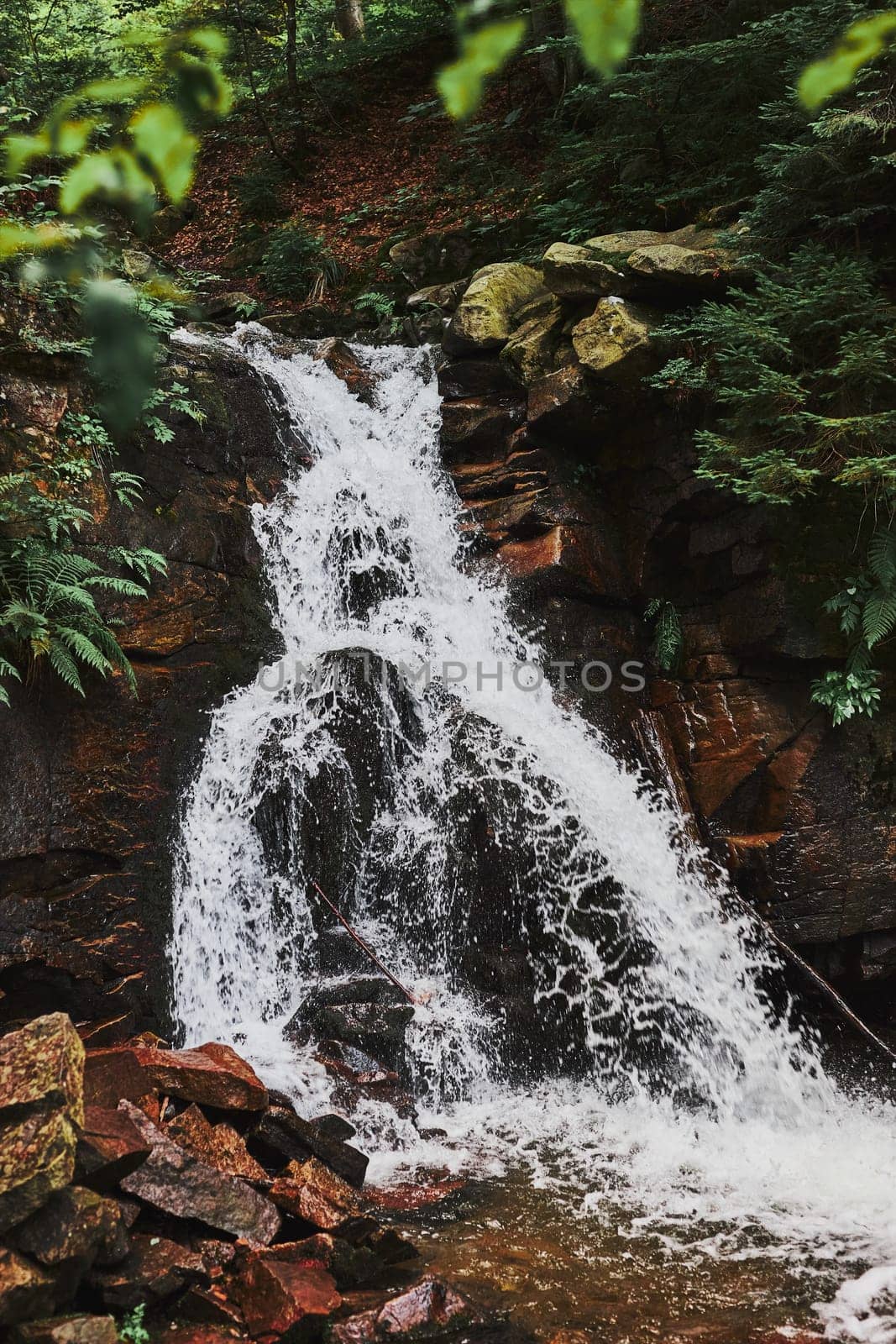Mountain waterfall. Mountain landscape. Natural scene. Beauty in nature