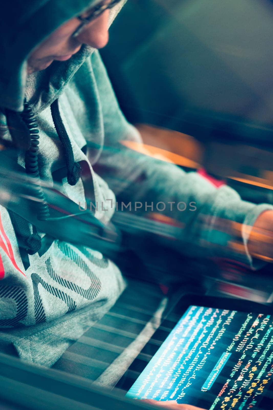 Hacker using computer, smartphone and coding to steal password and private data remotely from car. Screen displaying program code, website development, application building, password and private data