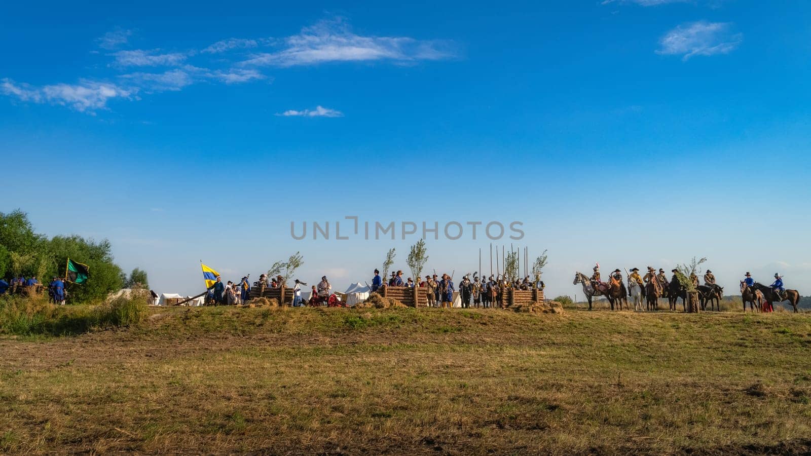 Gniew, Poland, Aug 2020 Polish hors cavalry, Hussars, pikemans and musketeers behind fortifications, historical reenactment of Battle of Gniew