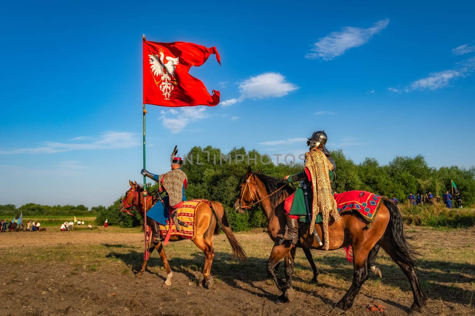 Gniew, Poland, Aug 2020 Polish hors cavalry, Hussars, riding with the flag, historical reenactment of Battle of Gniew