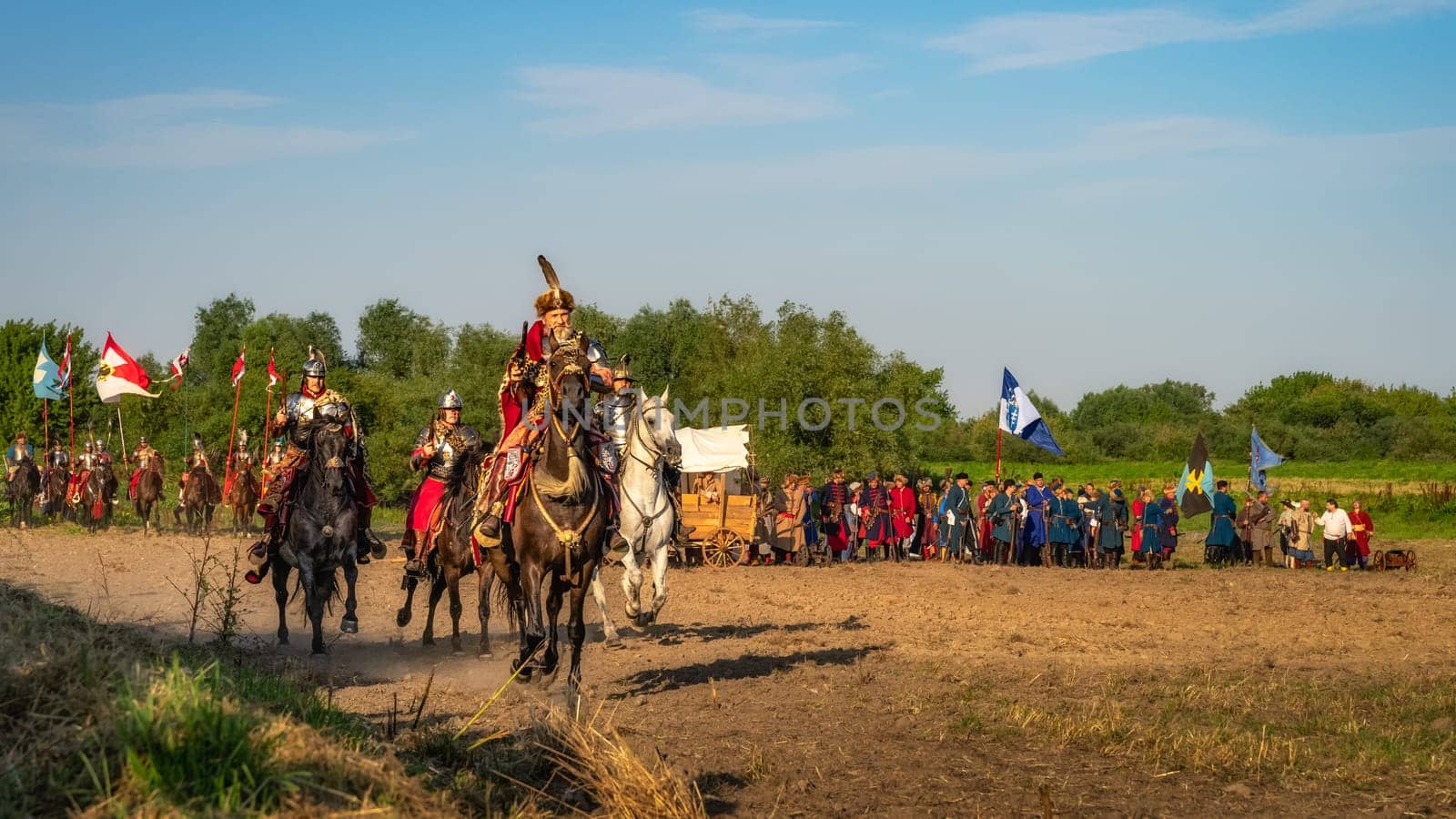 Gniew, Poland, Aug 2020 Castellan and Hussars, charging on a horses through a battlefield, historical reenactment of Battle of Gniew