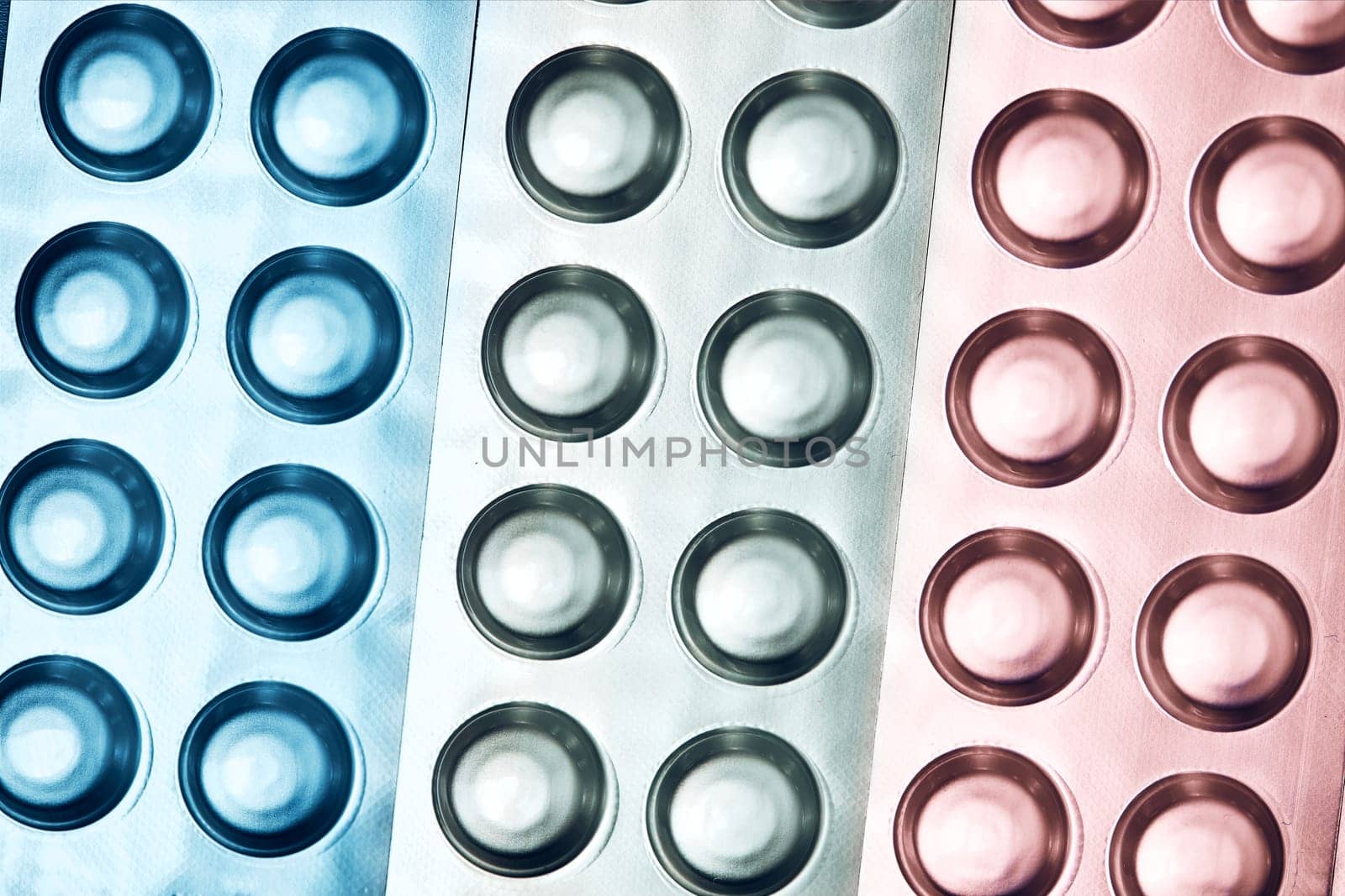 Tablets and capsules pill in blister packaging arranged in row. Medicines - tablets, pills in blister pack, medications drugs. Pharmaceutical industry concept. Pharmacy drugstore. Background with copy space