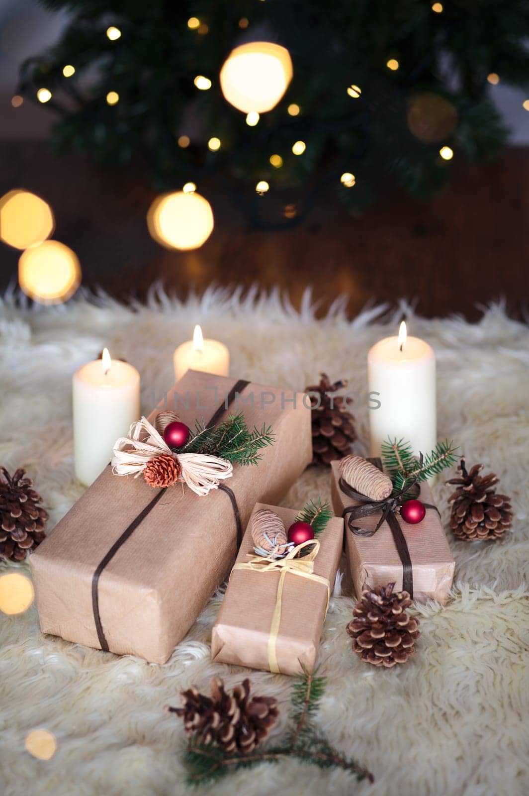 Christmas presents wrapped with paper put in front of the tree
