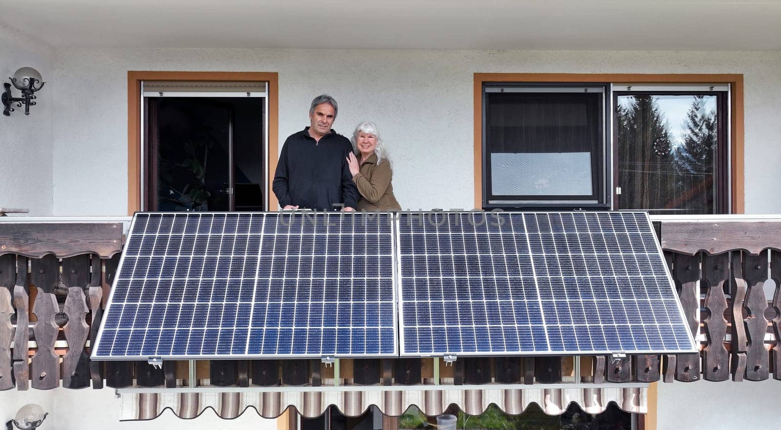 A woman and her husband are happy about the new balcony power plant