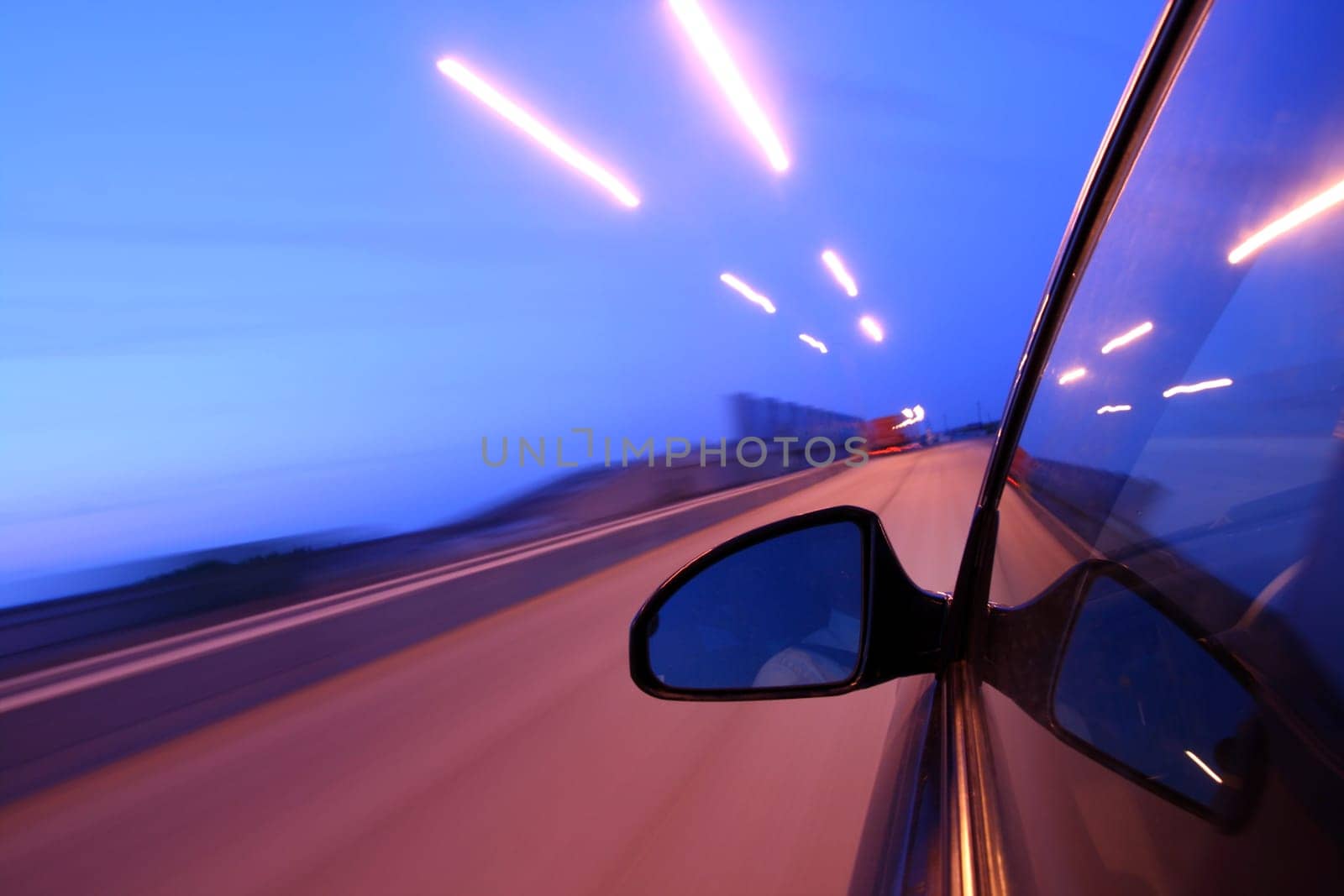 speed drive on car at night motion blurred