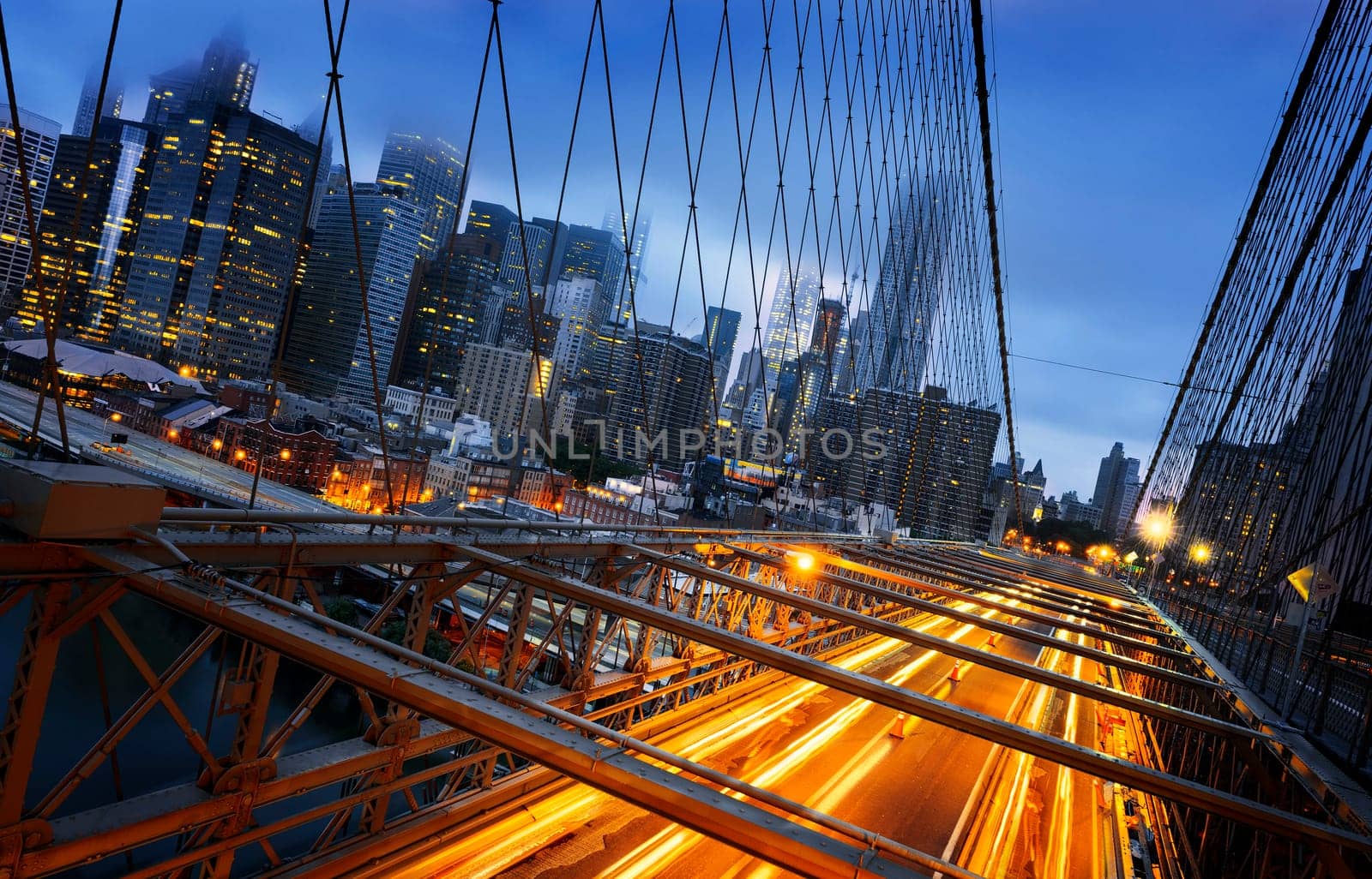 New York City - beautiful sunrise over manhattan with manhattan and brooklyn bridge USA