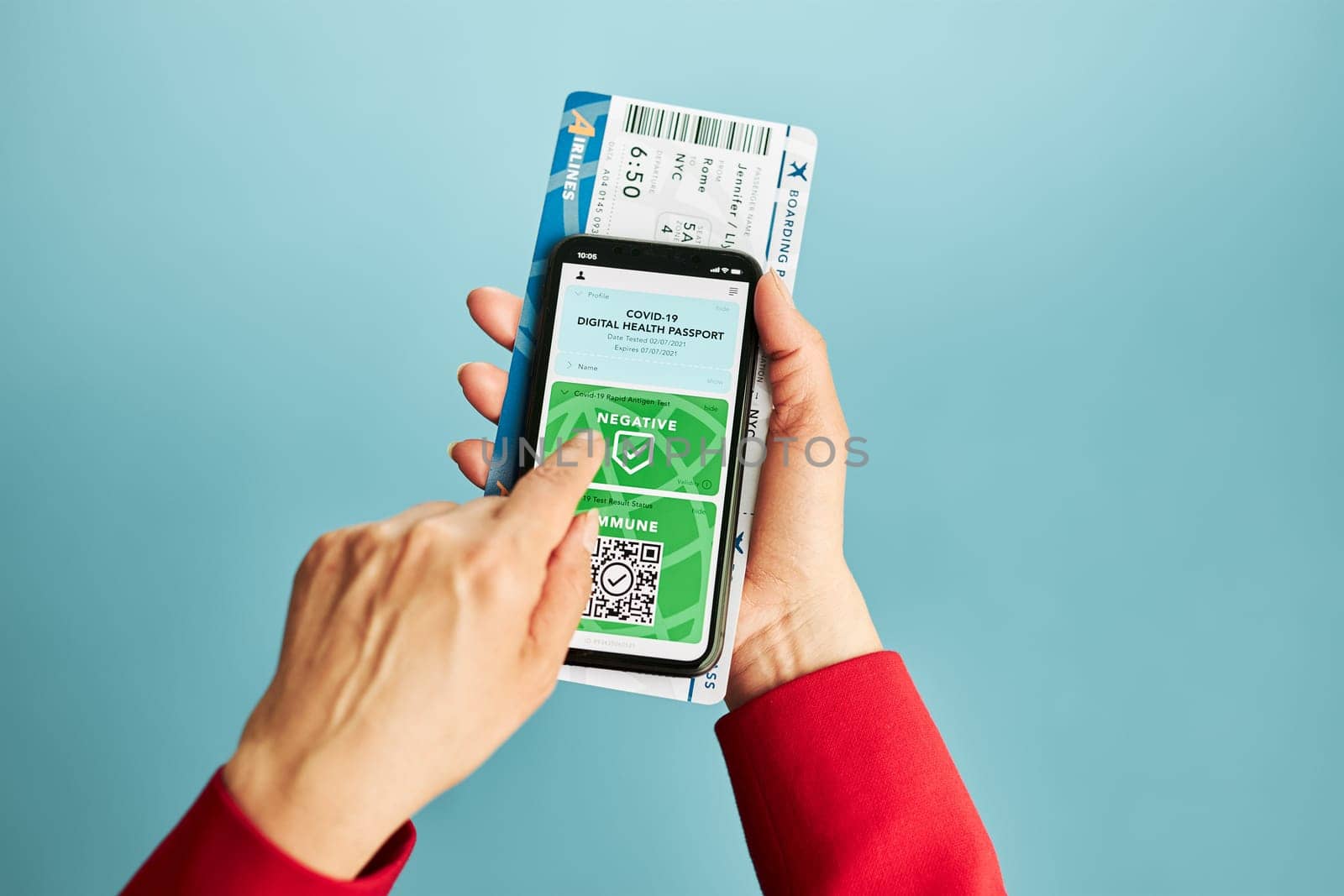 Digital covid certificate. Covid negative rapid digital test pass. Woman passenger holding digital medical pass on her mobile phone and airplane ticket. Traveler showing digital covid test result as medical pass for travel during covid-19 pandemic