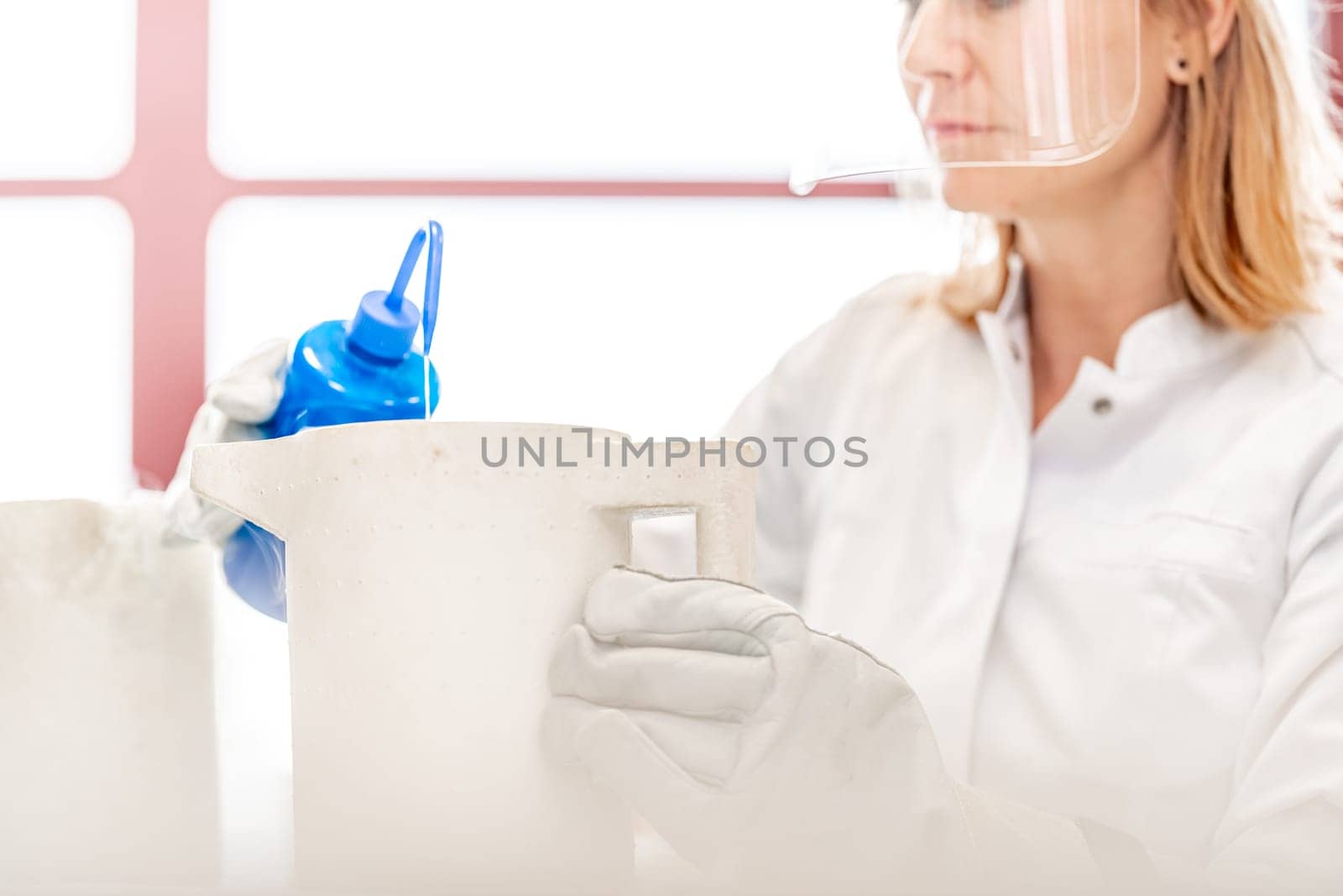 research of dangerous chemical substances in a biochemical laboratory. female scientist uses protective equipment. High quality photo