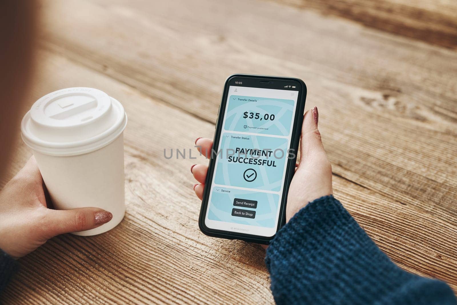 Woman paying with smartphone for online shopping. Paying using fast secure payment system. Woman paying bills using express payment technology. Paying expenses online. Ordering product online using smartphone. Confirmation payment successful displayed in store app on smartphone screen. Express payment