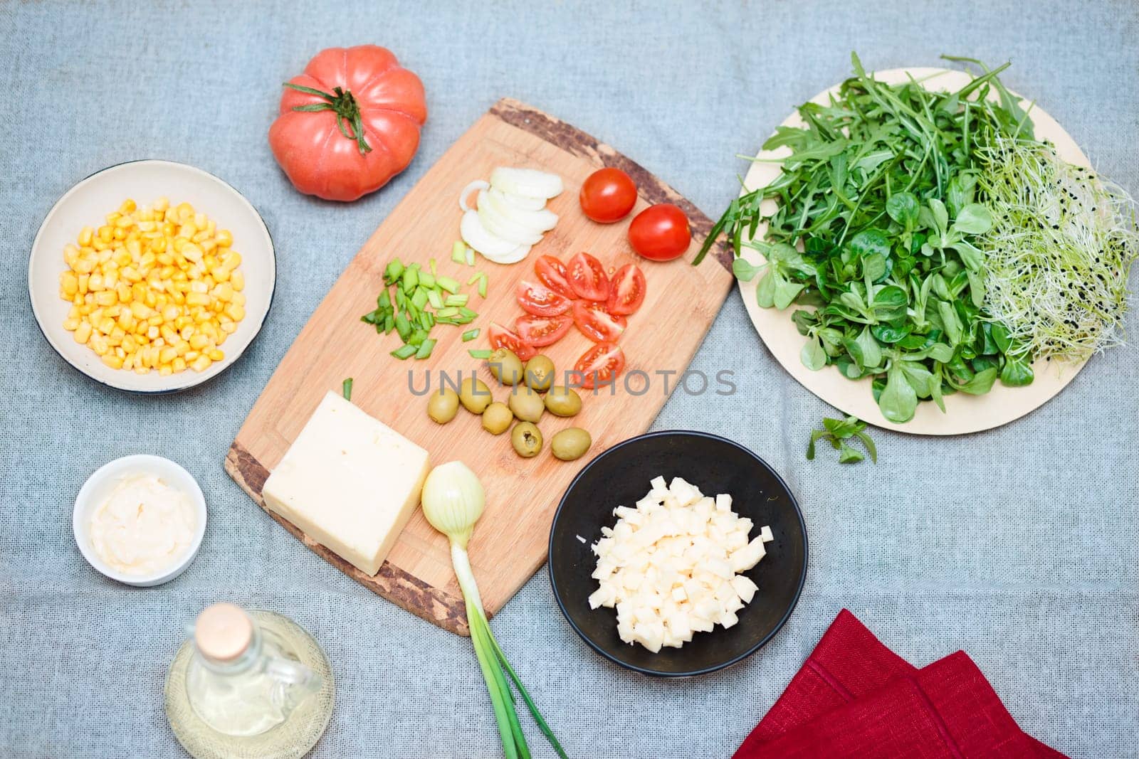 Preparing healthy snacks with fresh cheese and vegetables
