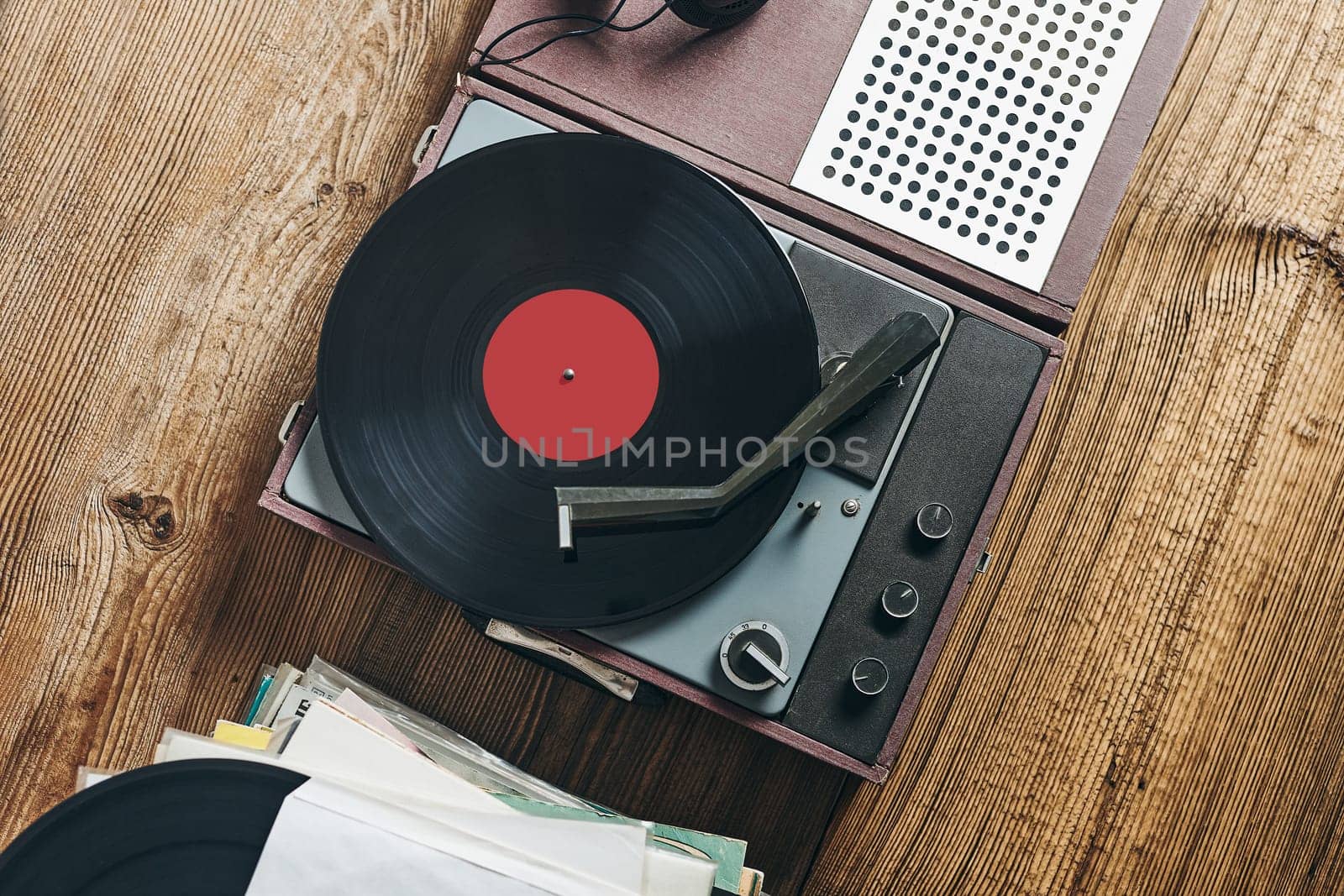 Listening to music from vinyl record. Playing music from analog disk on turntable player. Enjoying music from old collection. Relaxing at home. Retro and vintage. Audio stereo equipment. Analog sound