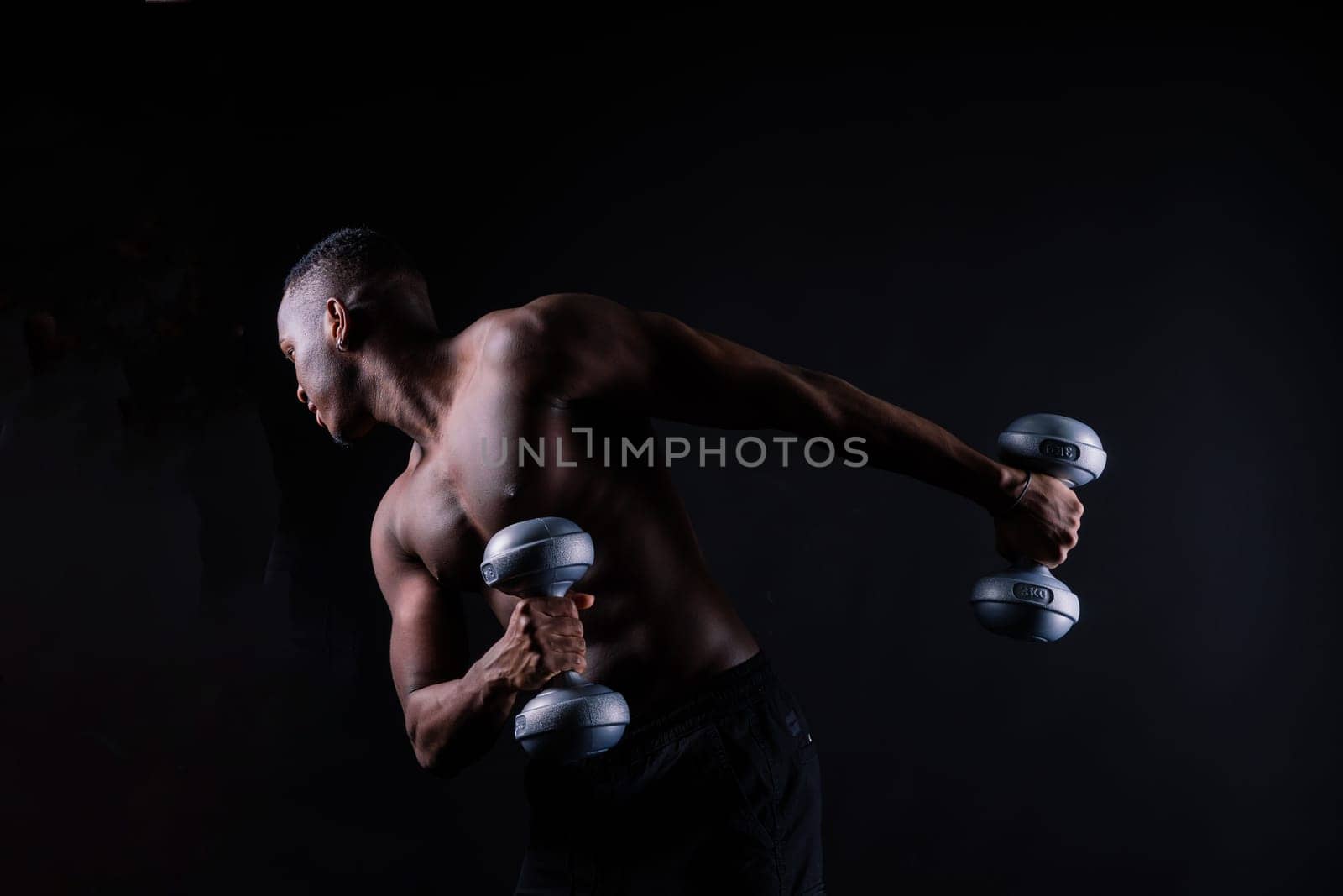 Muscular black african man with muscles abs abdominal, exercise determination and success